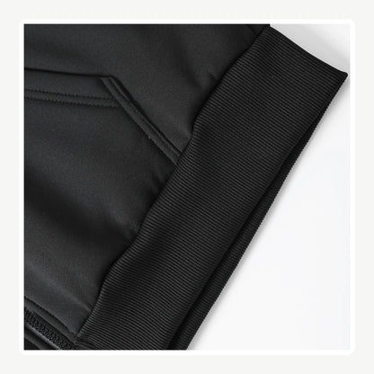 Black hoodie pocket and ribbed cuff close-up