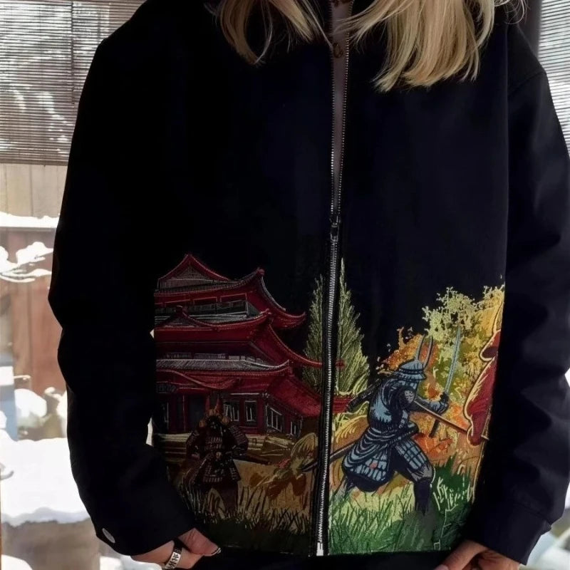 Model wearing black jacket with samurai artwork, front detail