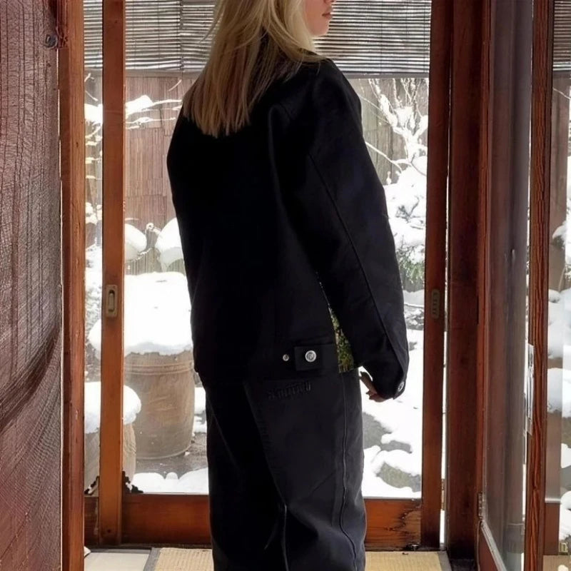 Model showing black jacket from the rear and side