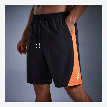 LetsBorn men's training shorts — orange on model