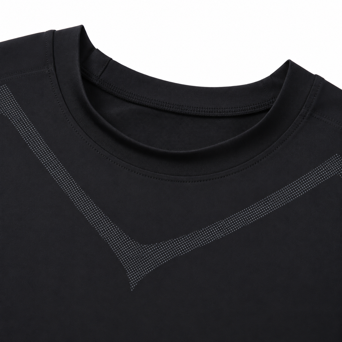 Close-up of the black compression tank's round neckline and charcoal dotted chest pattern.