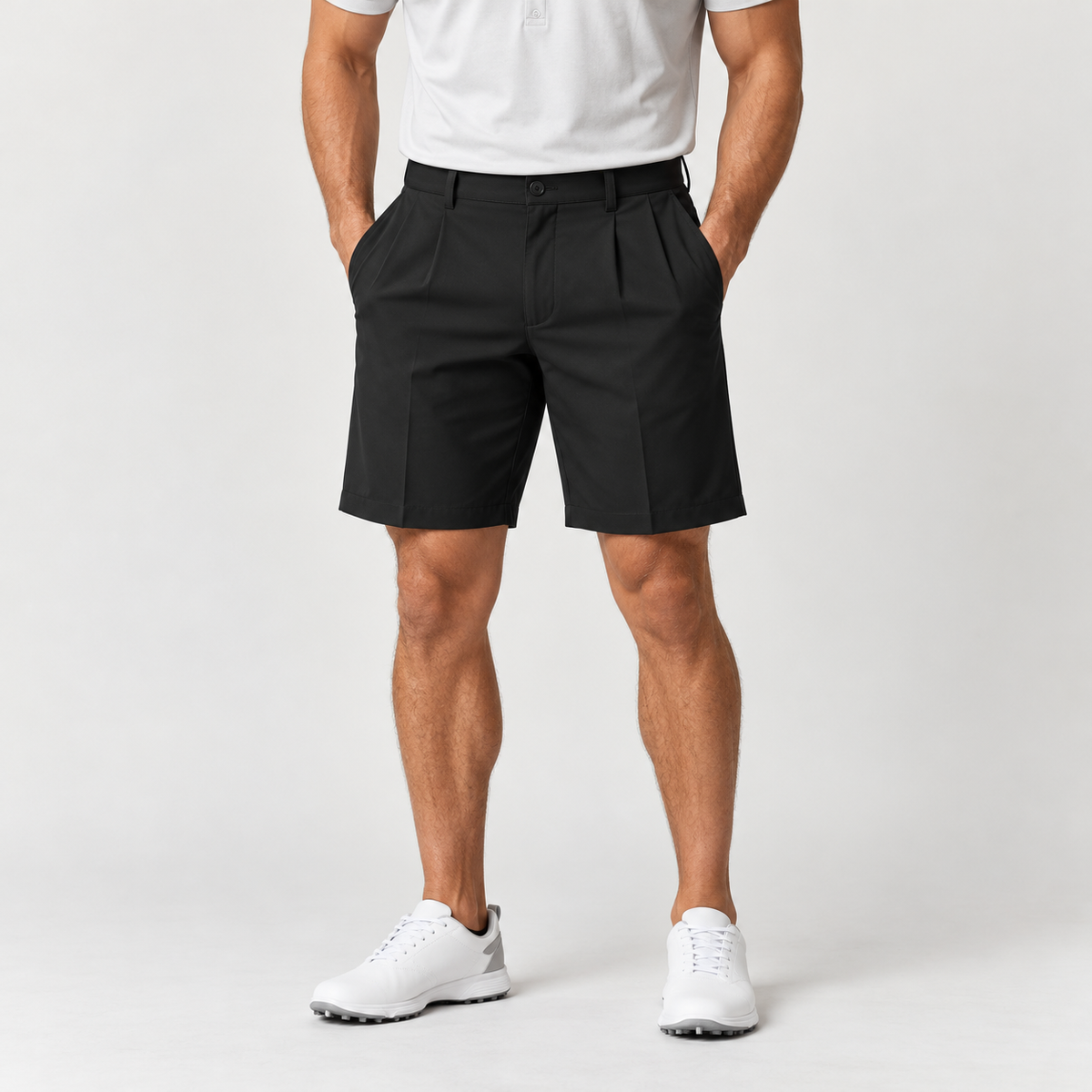 Black men's pleated golf shorts on male model in neutral studio