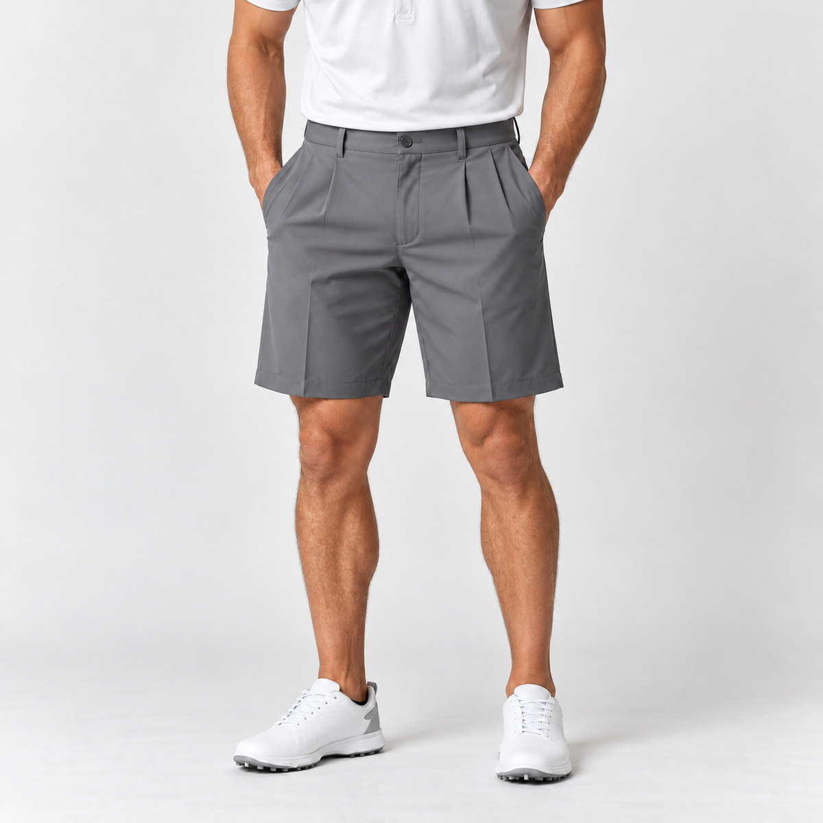 Grey men's pleated golf shorts on male model, front view