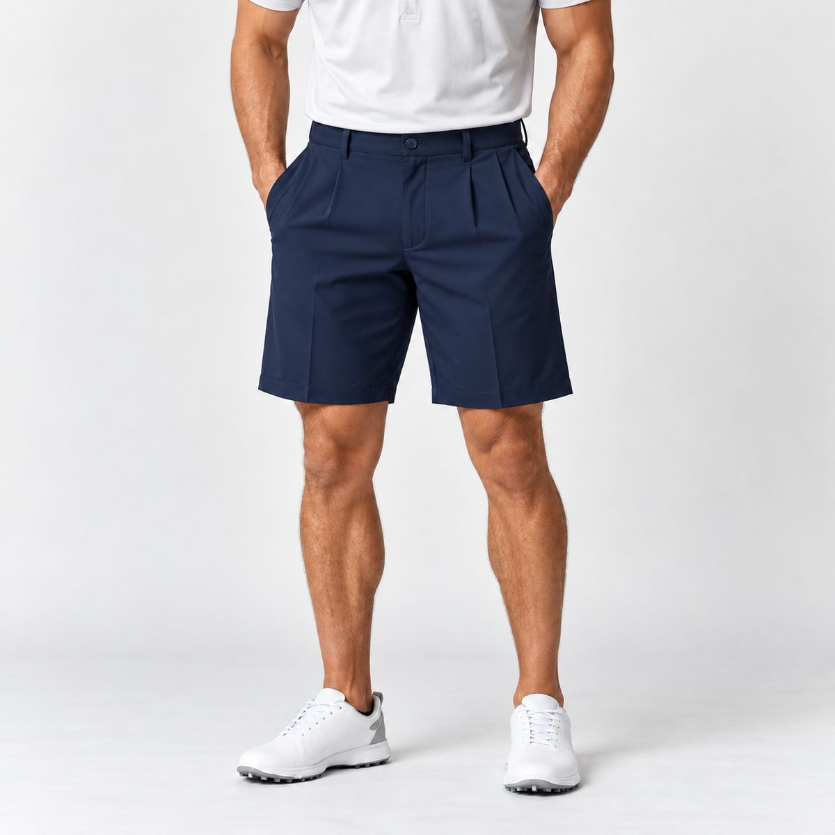 Navy men's pleated golf shorts on male model wearing white polo