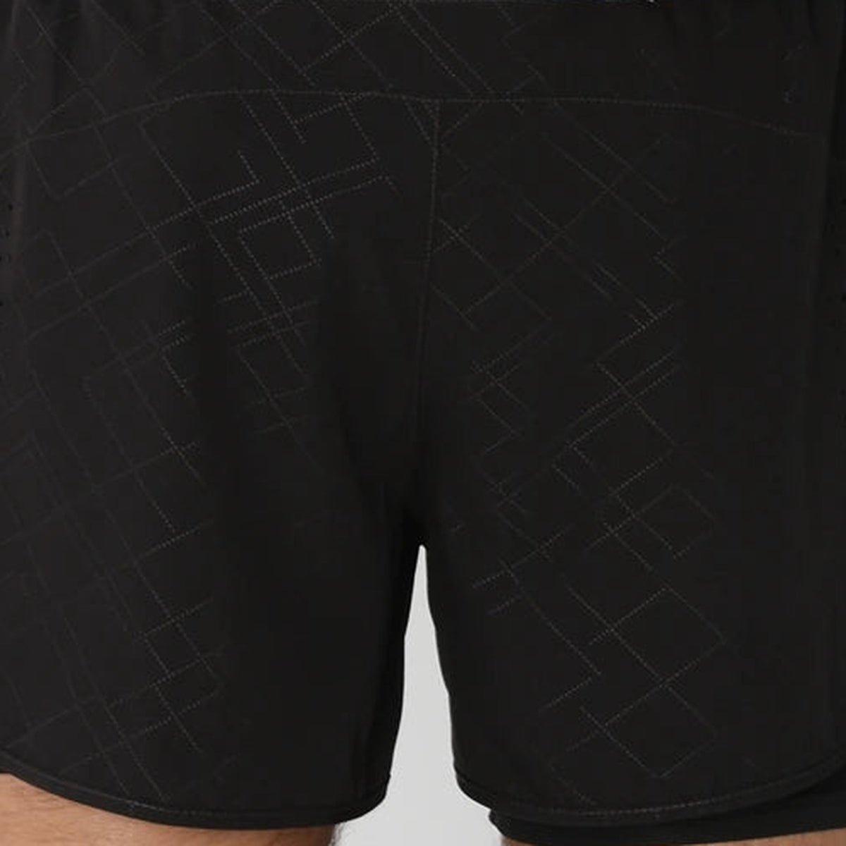 Close view of the subtle tonal geometric pattern on the Black Stripe running shorts.